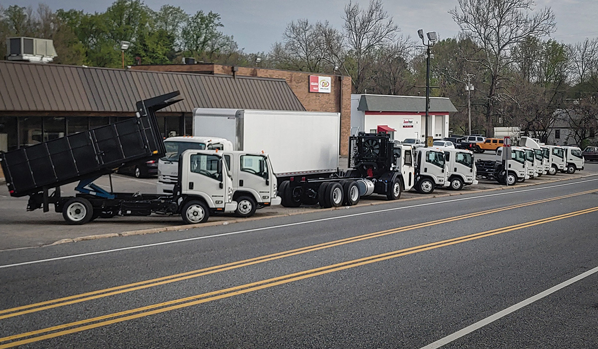 Photo of Isuzu trucks at dealership