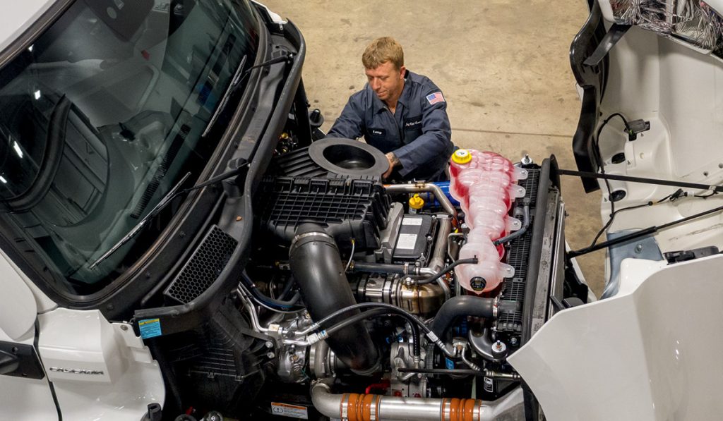 Photo of technician working on heavy duty truck